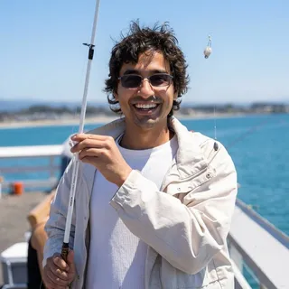 Sufyan Dawoodjee smiling aboard a boat